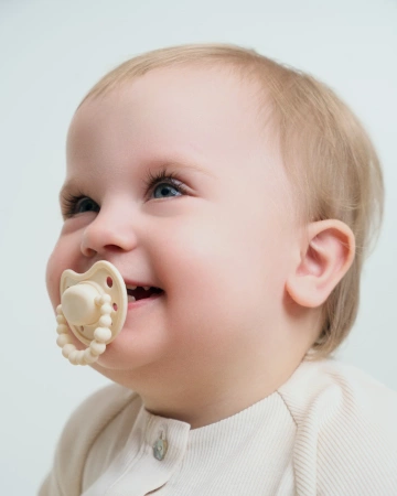 LUU Kids - Smoczek pozycjonujący - American Cream